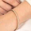 Elegant Half-Eternity 14K Gold Tennis Bracelet with Moissanite on Wrist