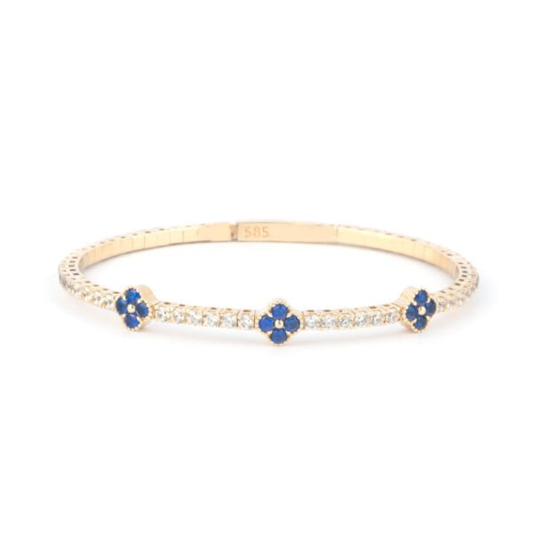 14K gold tennis bracelet with sapphire clover stones on white background