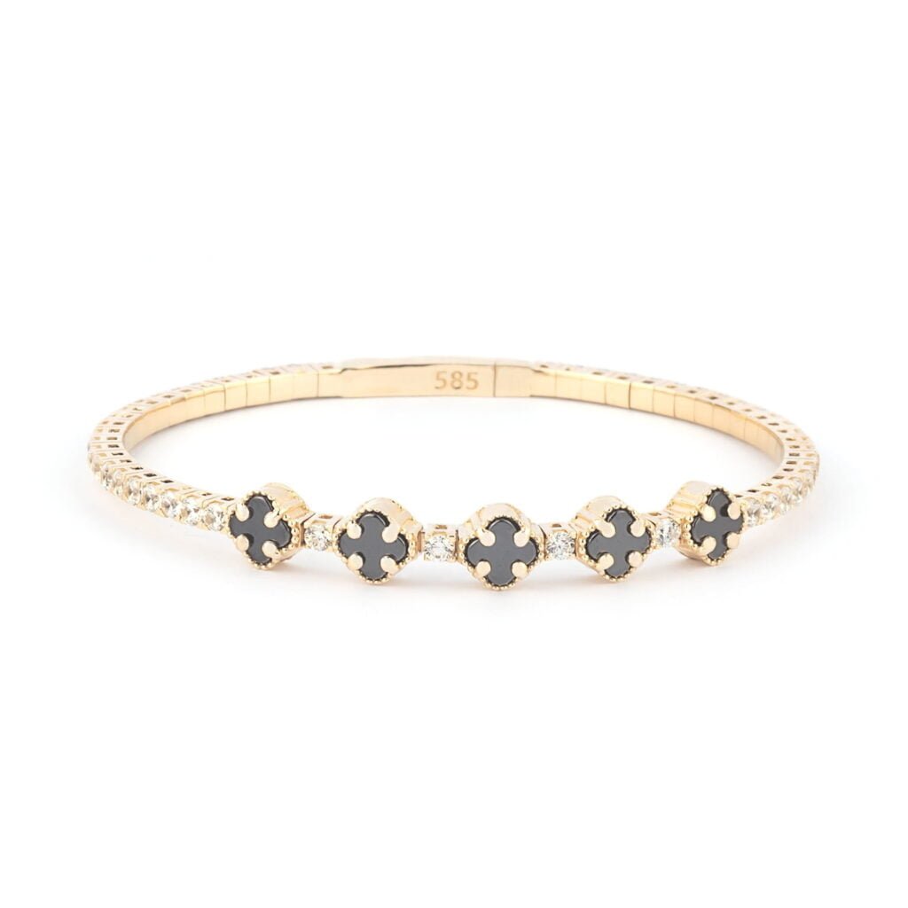 A single 14K gold bracelet with clover onyx and moissanite stones on a white background.